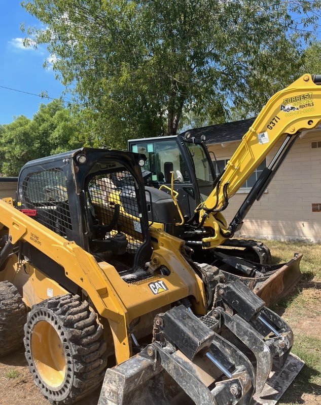 Molina Demolition CAT skid steer and Yanmar mini excavator with grapple on a job site
