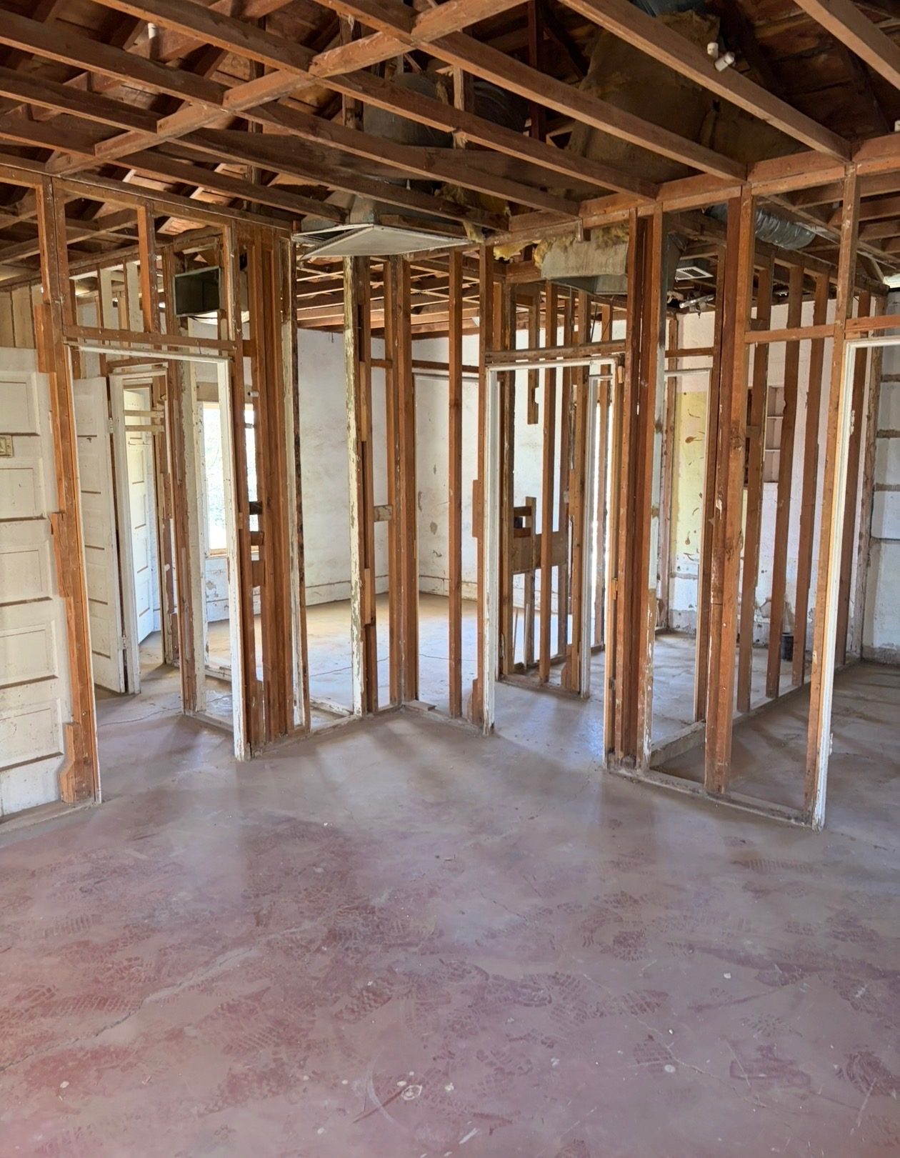 Whole-house interior strip-out down to the studs with exposed trusses